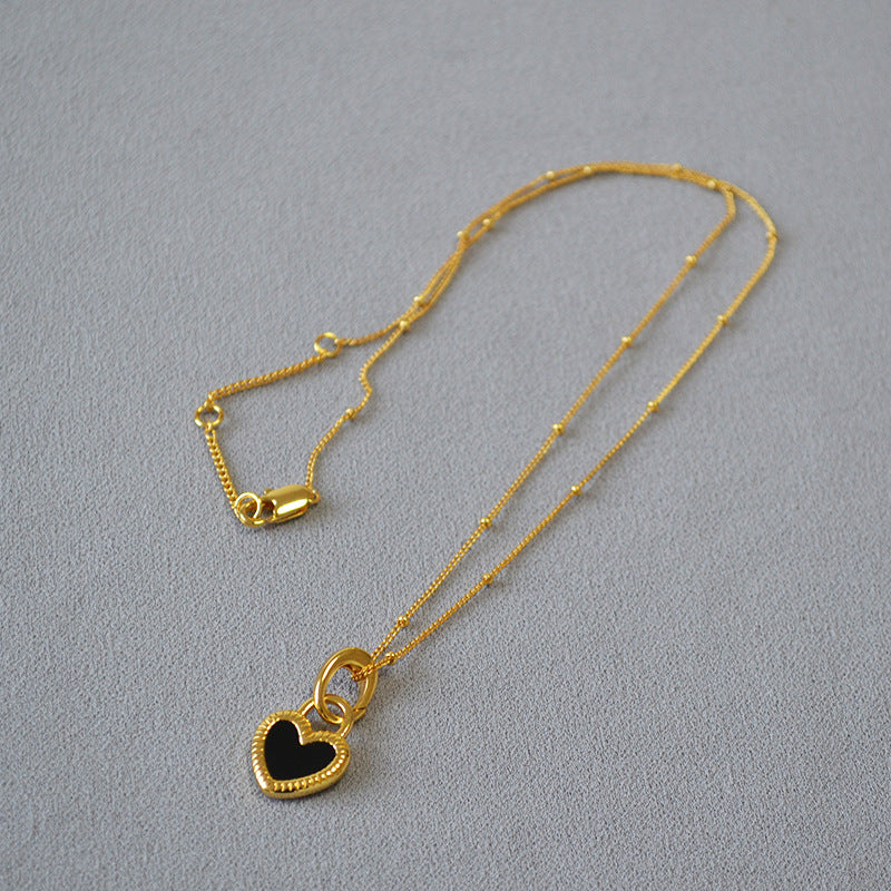 Collier cœur noir et blanc en or