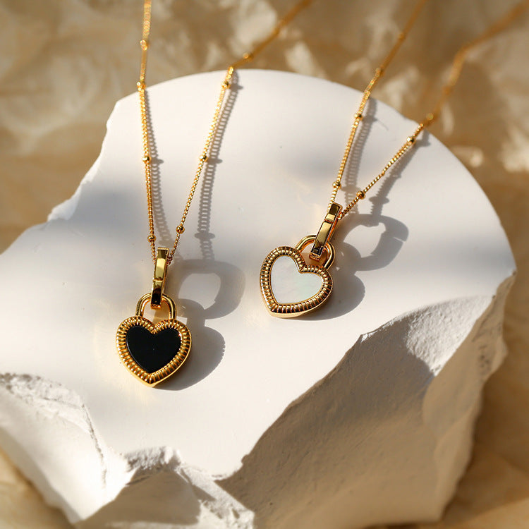 Collier cœur noir et blanc en or