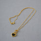 Collier cœur noir et blanc en or