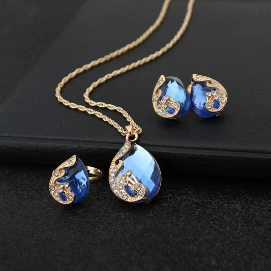 Ensemble collier et boucles d'oreilles en cristal bleu avec cristaux bleus en or