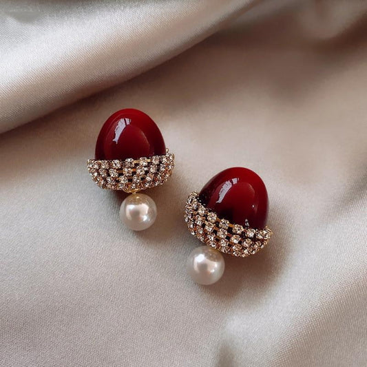 Boucles d'oreilles en noisette rouge avec perles