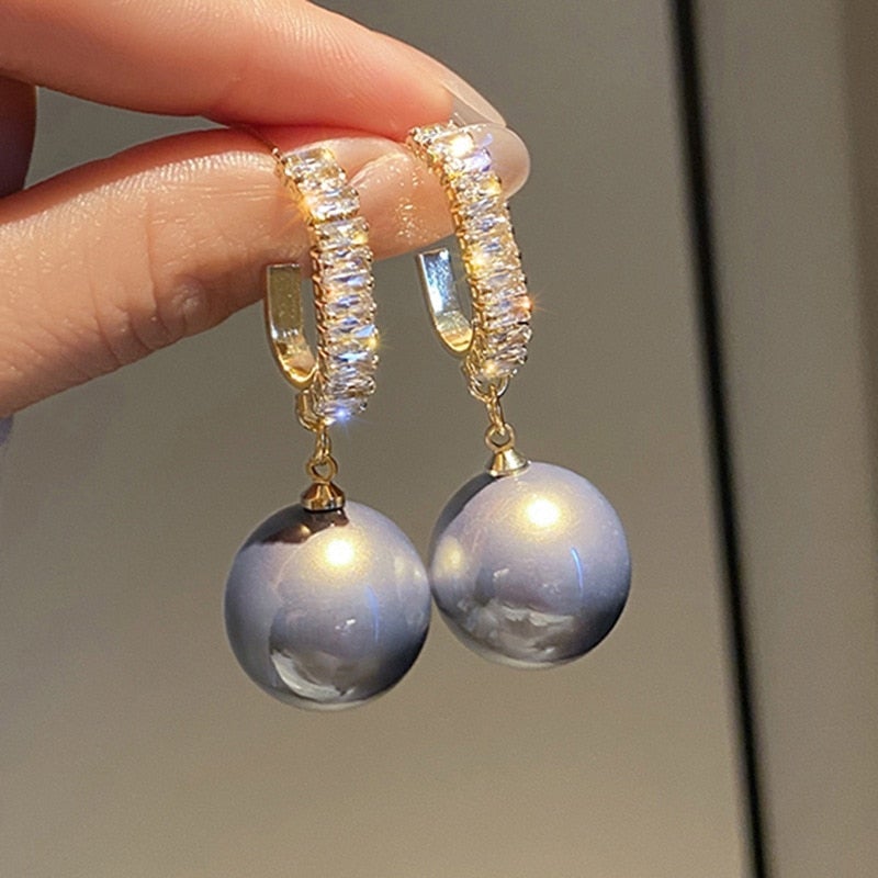 Boucles d'oreilles de luxe avec perles et zirconiums