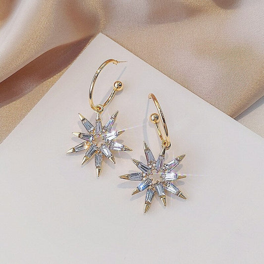 Boucles d'oreilles en forme d'étoile en or et argent