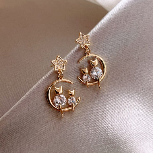 Famille de chatons luxueuse en épi de fer avec boucles d'oreilles à incrustations