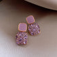 Boucles d'oreilles luxueuses violettes avec incrustation de zircone