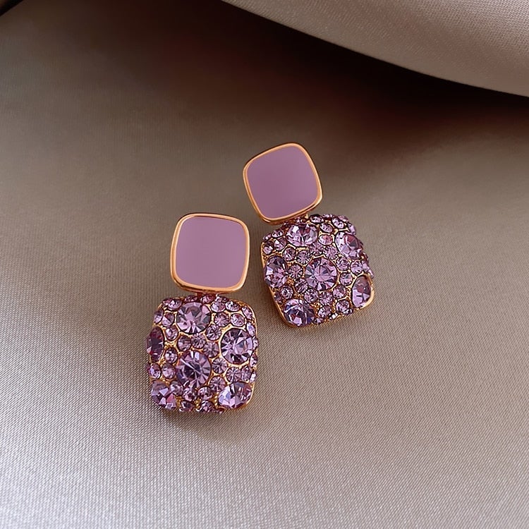 Boucles d'oreilles luxueuses violettes avec incrustation de zircone