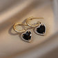 Boucles d'oreilles en forme de cœur noires en or