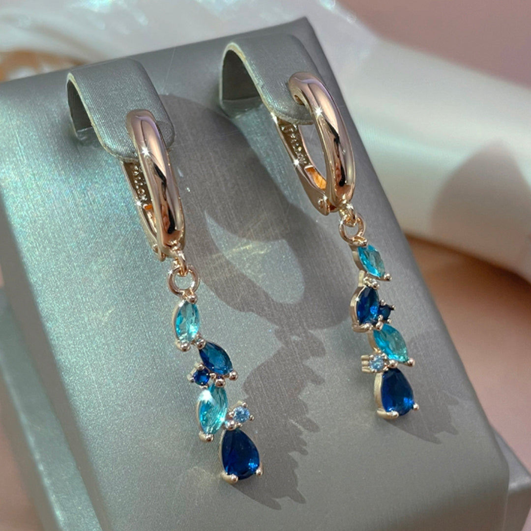 Boucles d'oreilles élégantes en cristal bleu et doré