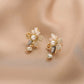 Boucles d'oreilles à pendentifs floraux avec perles en or