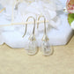 Boucles d'oreilles avec pendentif en dent de lion argenté