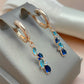 Boucles d'oreilles élégantes en cristal bleu et doré