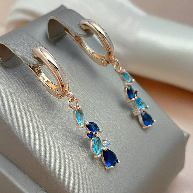 Boucles d'oreilles élégantes en cristal bleu et doré