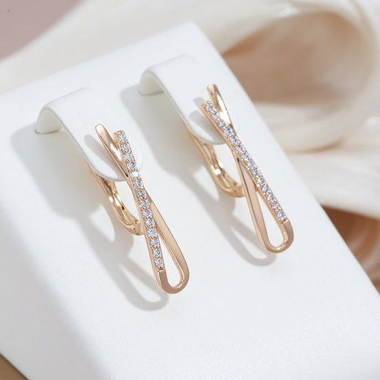 Boucles d'oreilles en or à brillants croisées