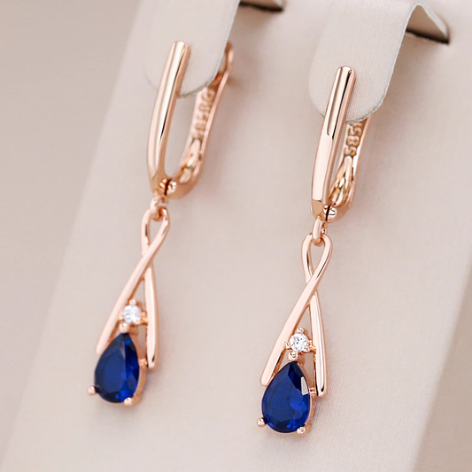Boucles d'oreilles à pendentif bleu en or