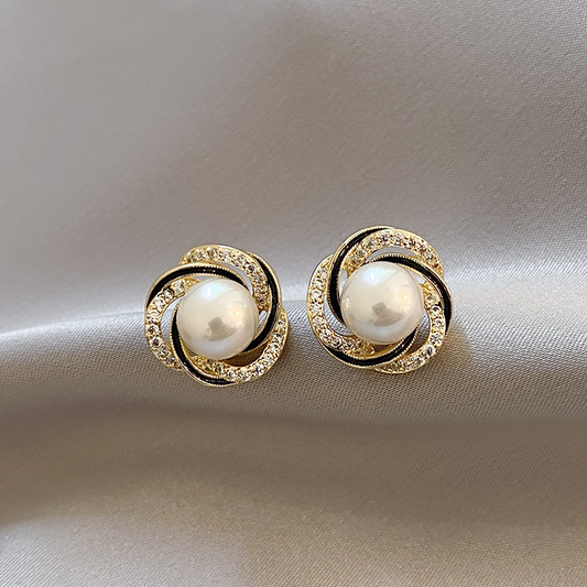 Boucles d'oreilles en forme de sphère dorée brillante