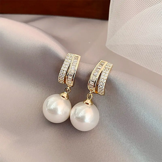 Boucles d'oreilles rondes brillantes avec perles