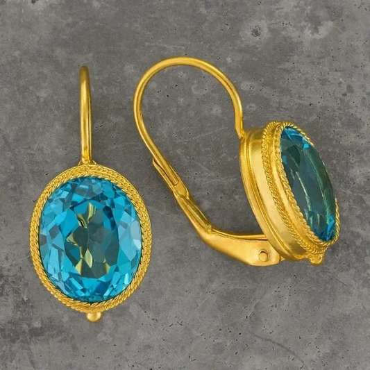 Boucles d'oreilles vintage en cristal bleu avec finition en or