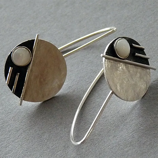 Boucles d'oreilles vintage rondes avec opale blanche