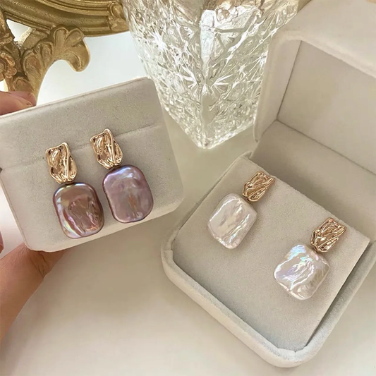 Boucles d'oreilles élégantes en perles baroques et or