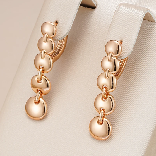 Boucles d'oreilles pendantes élégantes plaquées or