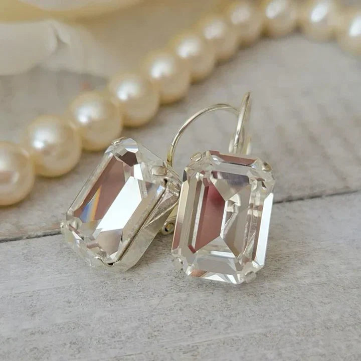 Boucles d'oreilles vintage en verre blanc