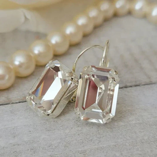 Boucles d'oreilles vintage en verre blanc